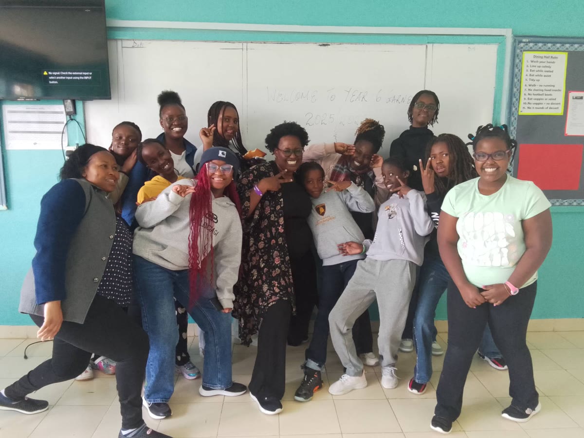 Girls from the IshaForge track with their mentors after a session