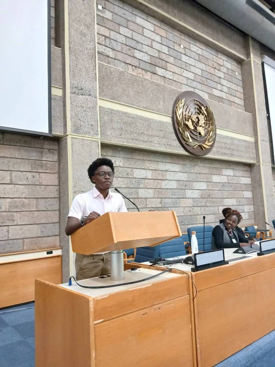 A young man addressing the assembly from the United Nations podium